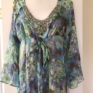 Light and flowing blouse with beautiful beading.